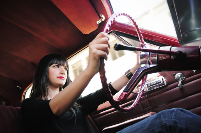 Woman driving confidently after hypnotherapy for driving anxiety