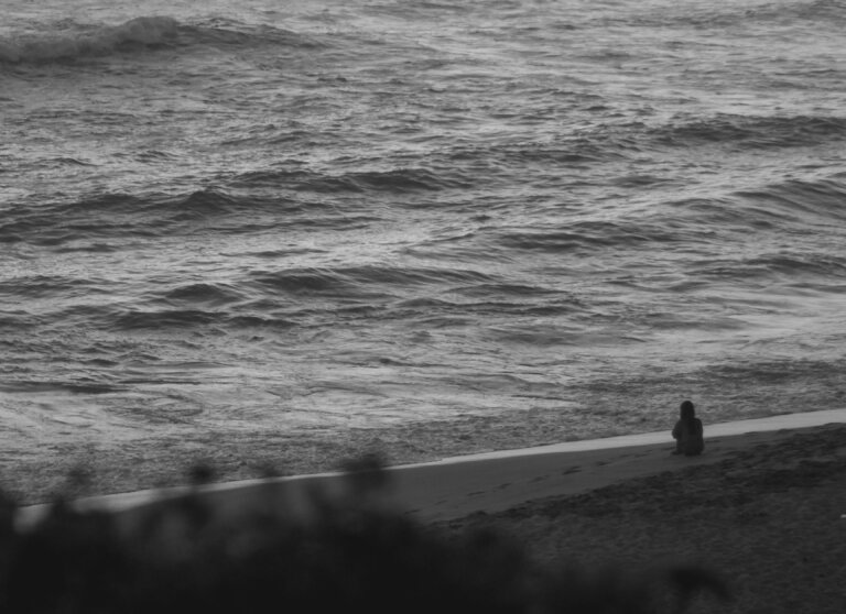 A person sitting calmly amid a storm, staying centered despite turbulent surroundings. panic attacks