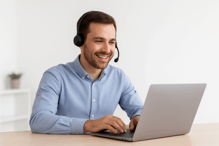 A man sits in front of his laptop during an online meeting