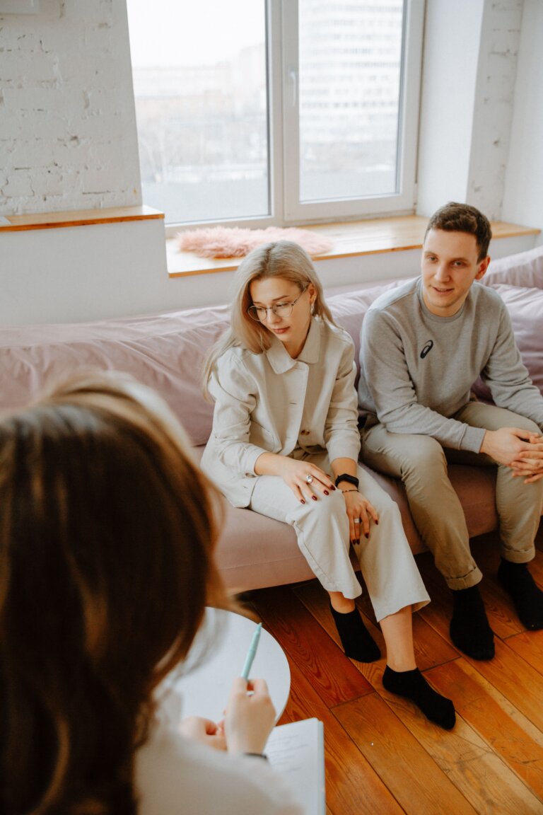 Couple in a supportive therapy session with a professional therapist