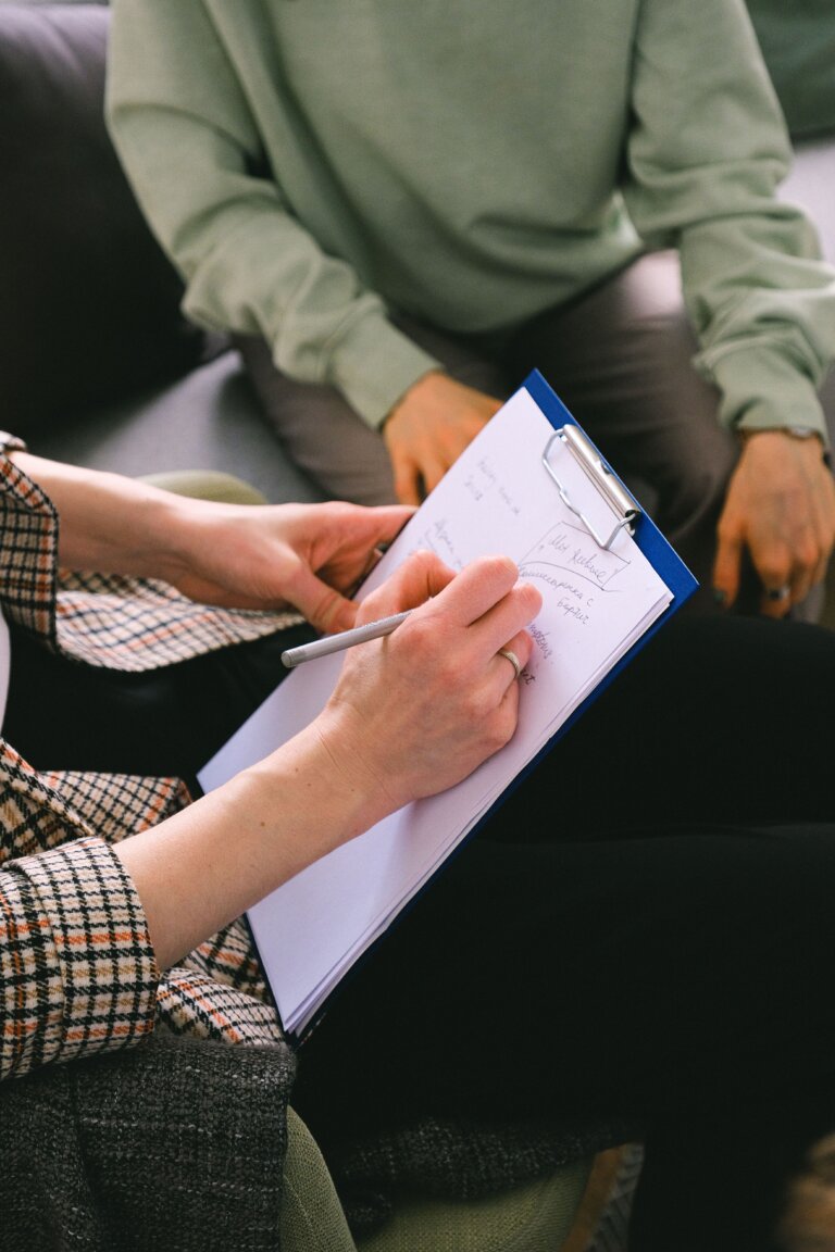 Person participating in a professional hypnotherapy session with eyes closed, Relationship Problems